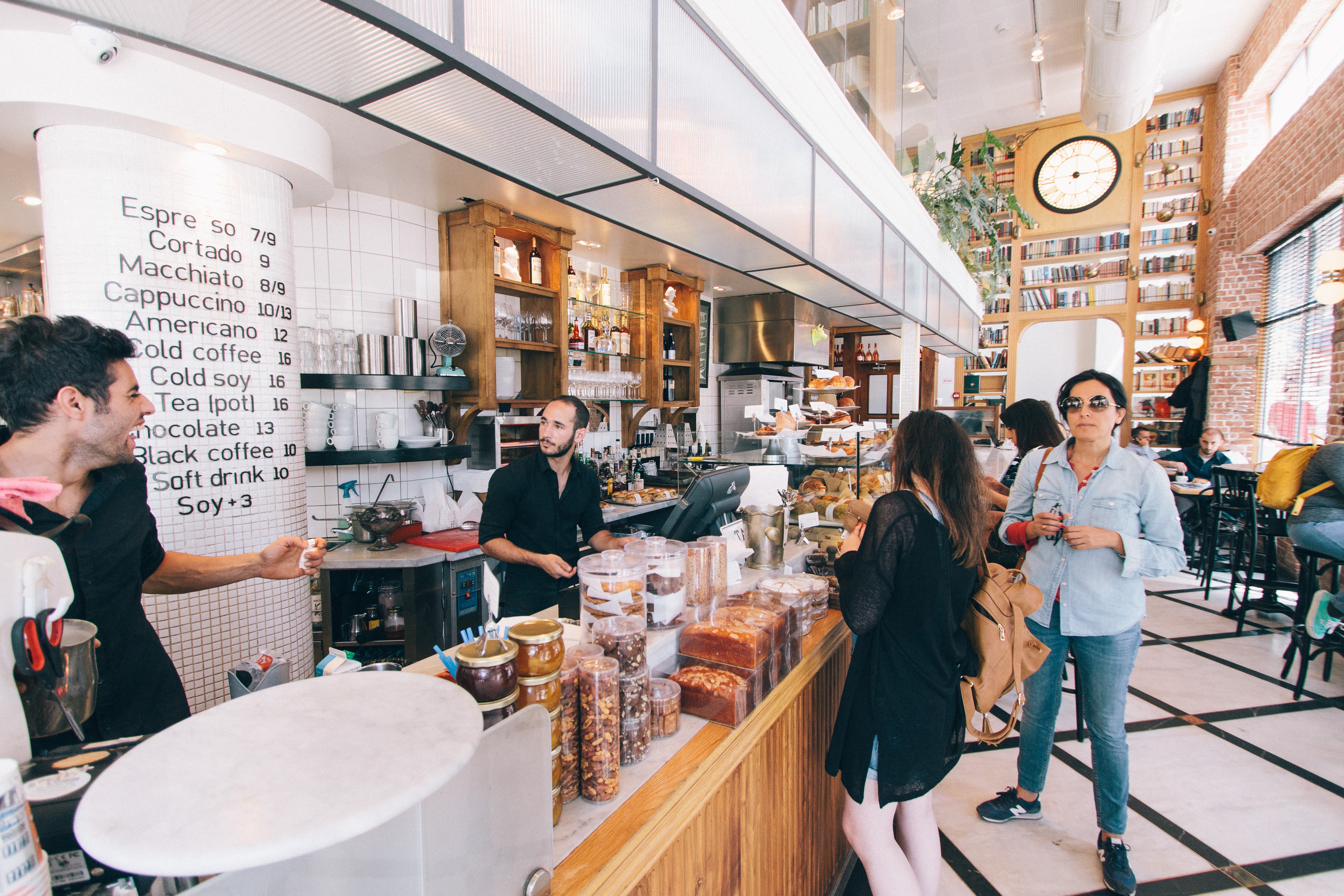 Employees working at a large coffee shop