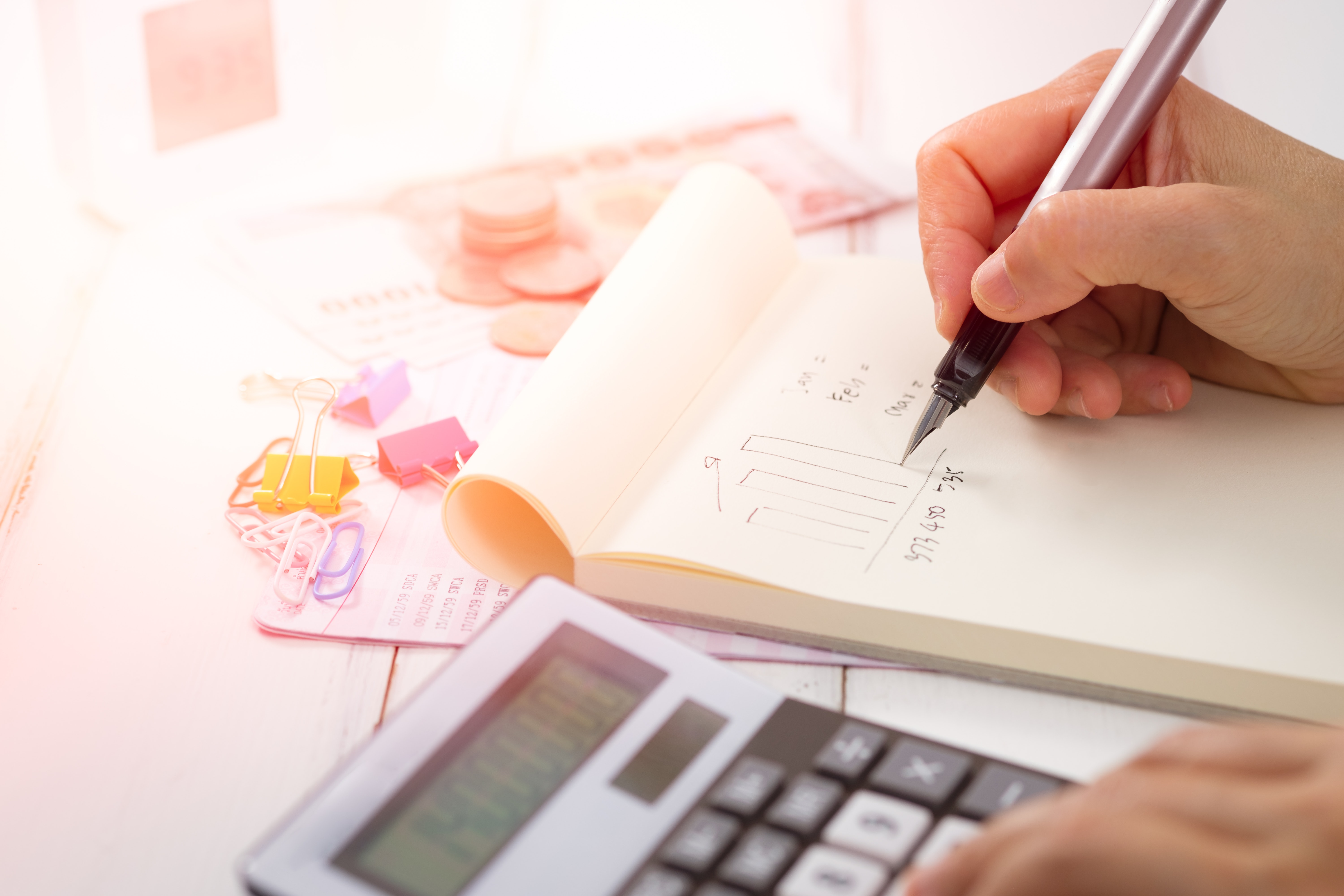 Business Owner Crunching Numbers to Obtain a $10000 Cash Advance