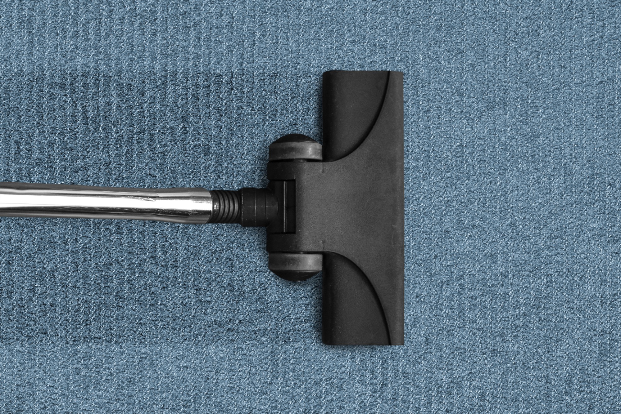 A carpet cleaner at work