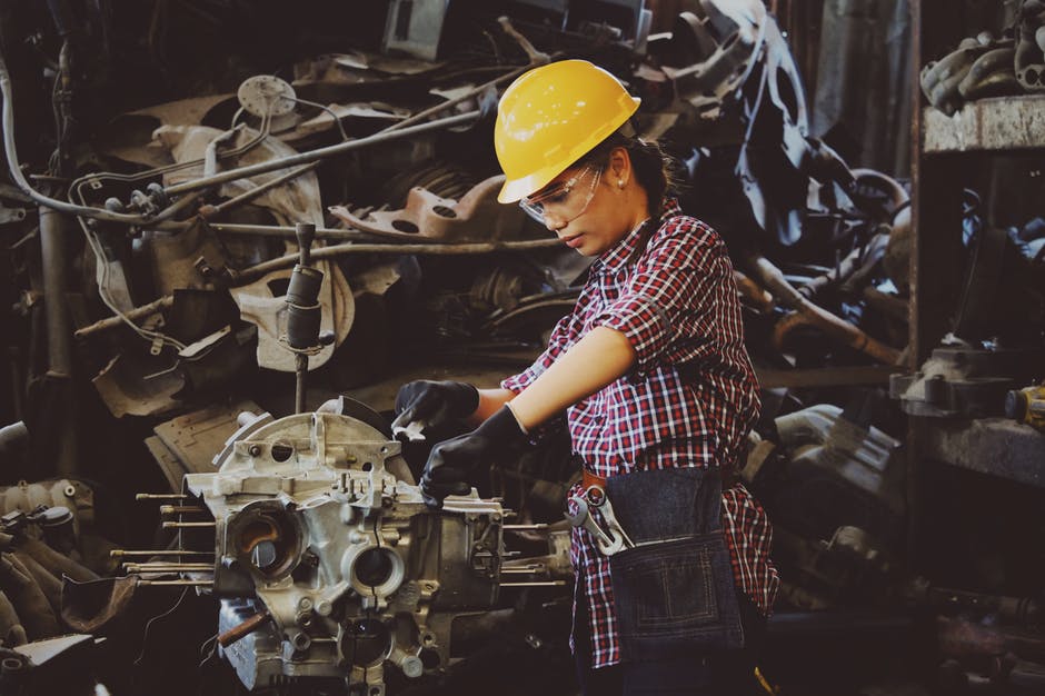 Woman Working on Equipment Purchased with a Machinery Loan