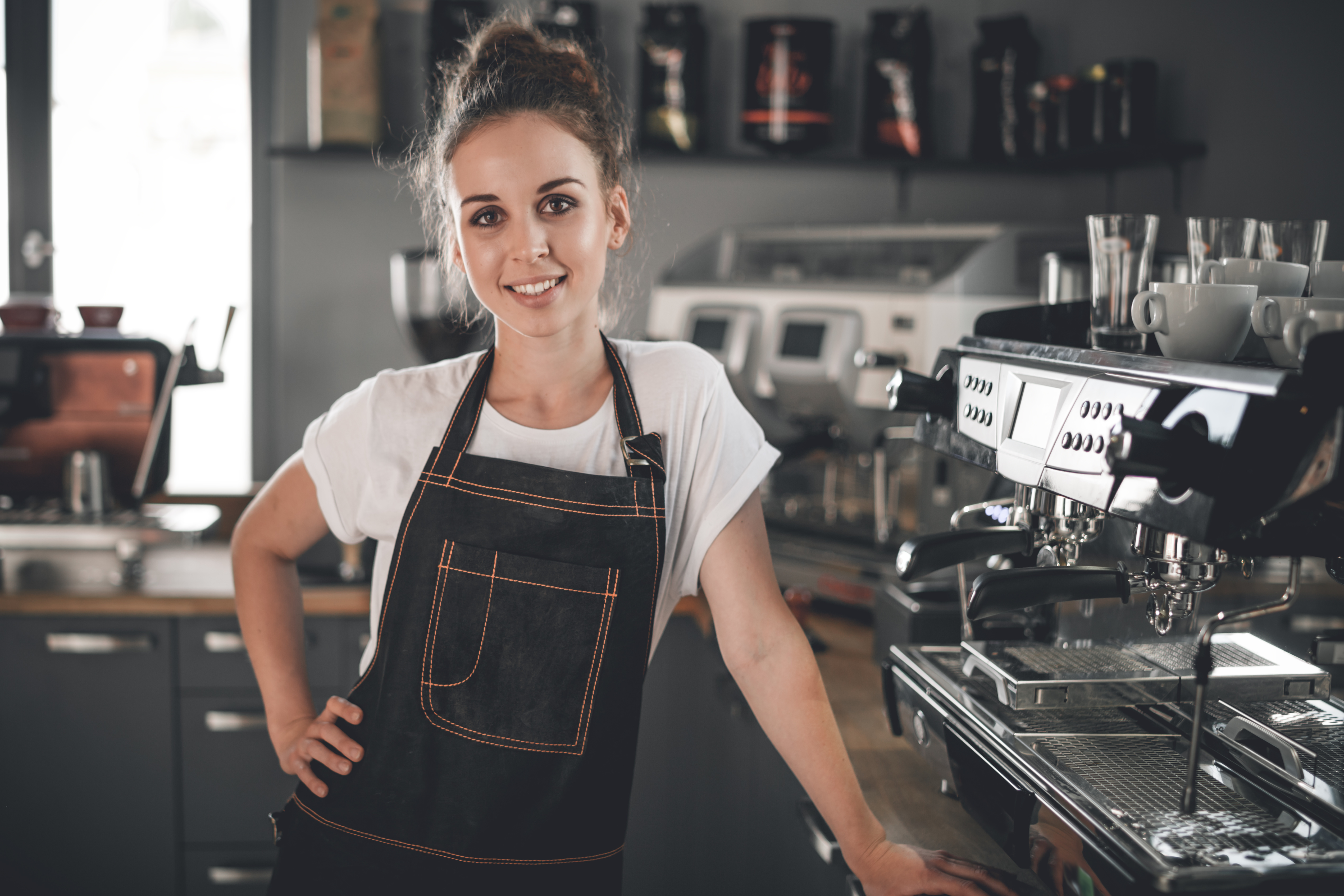 Woman Working in a Coffee Shop after Receiving the Paycheck Protection Program Benefit